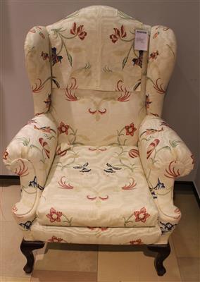 Ohrenbackenfauteuil um 1925/30 geschweiftes Hartholzgestell mit braun mattierten Füßen, - Weihnachtsauktion Kunst,<br />Antiquitäten und Möbel