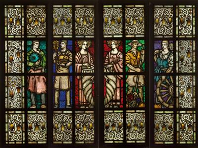 A leaded glass window featuring personifications of professions, signed Karl Muggly, - Oggetti d'arte (mobili, sculture, vetri e porcellane)