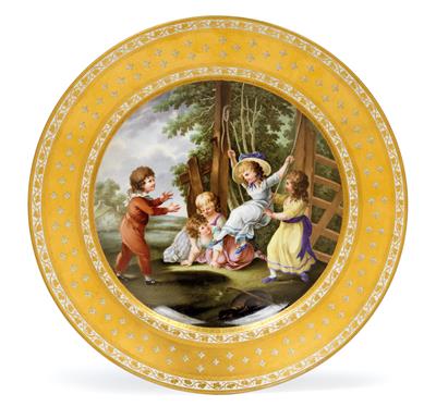 A plate decorated with 5 playing children, - Works of Art