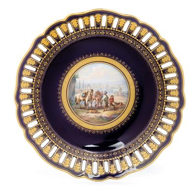 A plate decorated with equestrian scene, - Oggetti d'arte