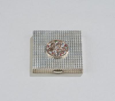 A silver compact with rose gilt floral application with ruby and emerald cabochons, probably Emile Faivre, Paris, before 1970 - Secese a umění 20. století
