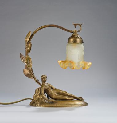 A bronze table lamp with a reclining female nude leaning against a tree trunk, c. 1930 - Secese a umění 20. století