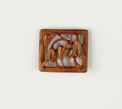 A wooden brooch with floral motifs, in the style of the Wiener Werkstätte - Jugendstil and 20th Century Arts and Crafts