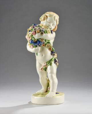 Hans Schoerk (Schörck), a standing putto with a flower garland, on a round base, model number 4769, designed in around 1916/17, executed by Wiener Manufaktur Friedrich Goldscheider, by 1922 - Secese a umění 20. století