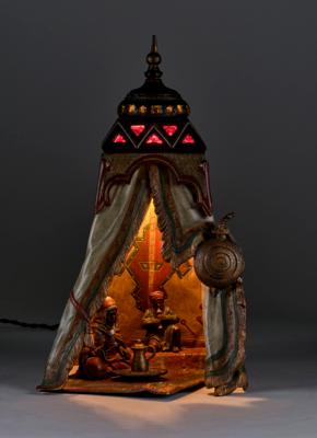 A table and fireplace lamp in Oriental style with a Bedouin and two seated figures on a carpet, in the manner of F. X. Bergmann, Vienna, designed in around 1900 - Secese a umění 20. století