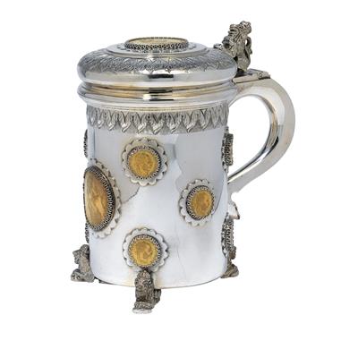 A lidded tankard with gold ducats, - Silver