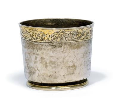 A footed cup, - Silver