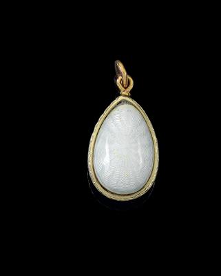 A pendant in the form of a miniature egg, - Silver