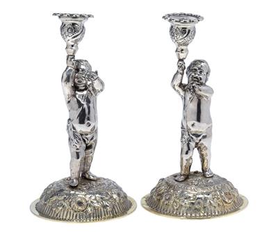 A pair of candleholders from Germany, - Argenti