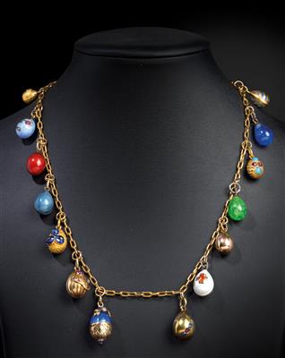 A chain with 14 egg pendants, - Stříbro