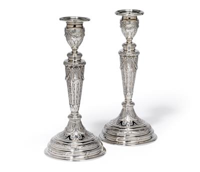A pair of candleholders, - Silver and Russian Silver