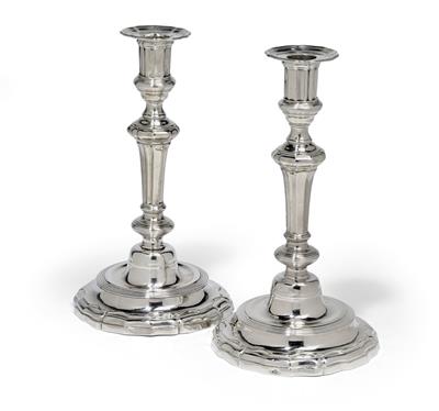 A pair of candleholders from France, - Silver and Russian Silver
