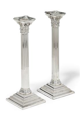 A pair of candleholders from Sheffield, - Silver and Russian Silver
