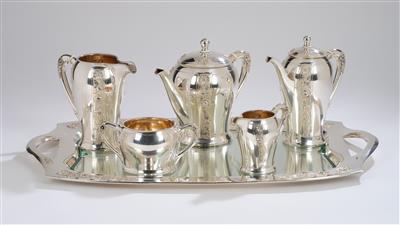 A large six-piece silver service with floral motifs, consisting of: a large handled tray, a coffee pot, a teapot, a large pot, a creamer and a sugar bowl, probably designed by Franz Schediwy, Vienna, by May 1922 - Secese a umění 20. století