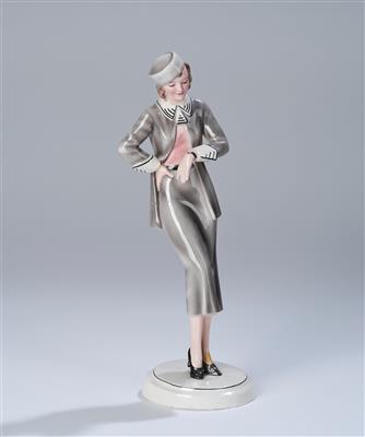 Stephan Dakon, a figurine: "Rendevous" (standing lady in a dress with hat) on a round base, model number: 6645, designed in around 1932/33, executed by Wiener Manufaktur Friedrich Goldscheider, to c. 1941 - Secese a umění 20. století