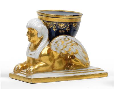 An inkpot supported by a sphinx, - Glass and porcelain