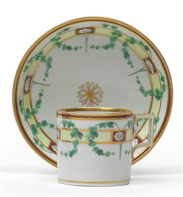 A cup and saucer with decoration, - Glass and porcelain