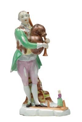 A figure of a street musician with bagpipes and dancing marionettes, - Sklo, Porcelán