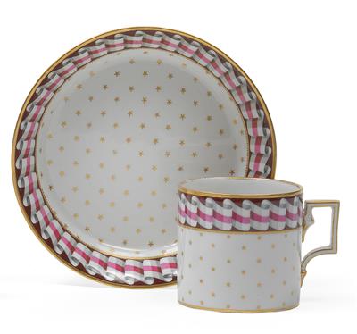 A cup and saucer with ribbon, - Vetri e porcellane