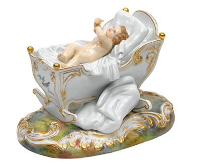 A figure of a boy in a cradle, - Glass and porcelain