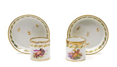 A pair of cups with saucers and matching amorettes among clouds, - Vetri e porcellane