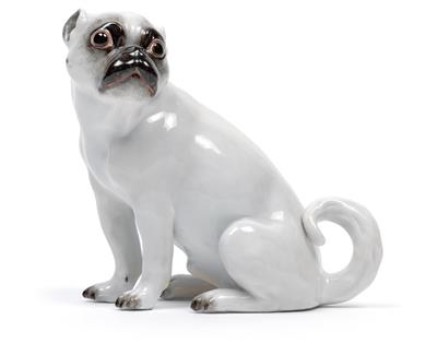 A seated pug dog, - Glass and porcelain