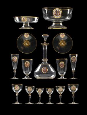 A dessert service bearing the gold, red and blue painted monogram CM in a white medallion, - Glass and porcelain