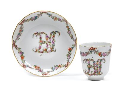 A cup and saucer bearing the floral monogram BCS, - Vetri e porcellane