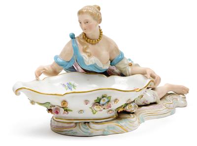 A figure of a reclining lady with bowl, - Glass and porcelain