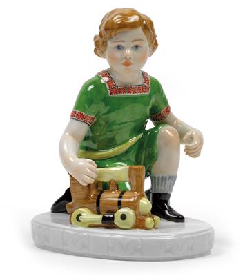 A figure of a boy with locomotive and ball, - Glass and porcelain