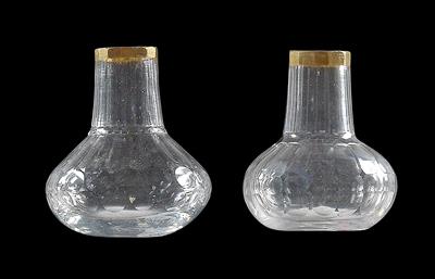 A pair of small rum bottles, - Glass and porcelain