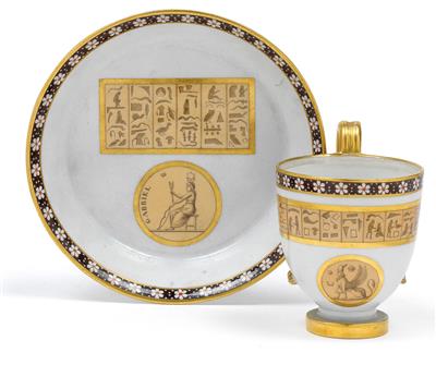 A cup and saucer with décor in the Egyptian manner, - Sklo, Porcelán