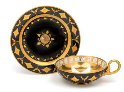 A design teacup with saucer, - Vetri e porcellane