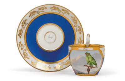 A cup with billing budgerigars and saucer, - Vetri e porcellane