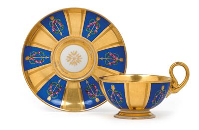 A teacup with saucer, - Vetri e porcellane