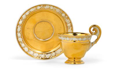 A gilt cup with gilt saucer, - Glass and Porcelain