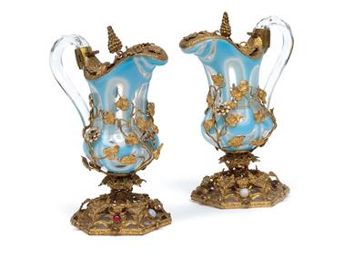 A pair of small glass jugs with gilt metal mount, - Vetri e porcellane