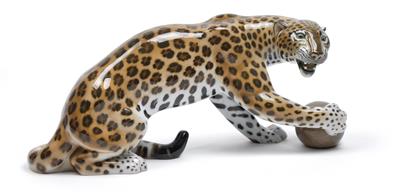 A figure of a leopard playing with a ball, - Sklo a Porcelán