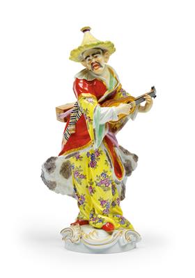 A Malabar figure playing the guitar, - Glass and Porcelain