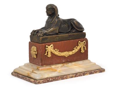 A sphinx, - Antiques: Clocks, Sculpture, Faience, Folk Art