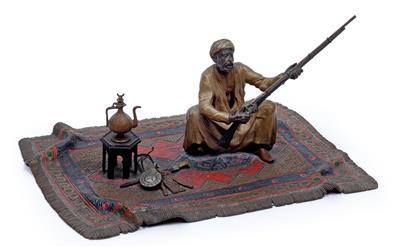 A figure by F. X. Bergmann: Arab with gun on rug, - Starožitnosti