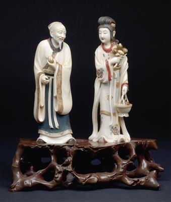 An ivory okimono of a man with peach and an okimono of a woman with peach tree branch and basket with peaches, - Arte e antiquariato