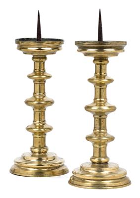 A pair of high candlesticks with discs, - Antiques and art