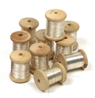 Ten spools of silver yarn with core for embroidery, - Umění a starožitnosti