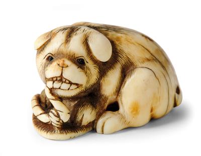 A Netsuke of a Puppy with a Sandal, Japan, 19th Century, Signed Ikko, - Starožitnosti - Část 1