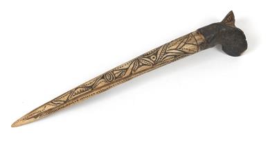 New Guinea or New Britain: a cassowary bone dagger with carved decorations. - Tribal Art