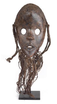 Dan, Ivory Coast, Liberia: A so-called ‘fire runner mask’, with large, round eyes, hair, plaits and beard. - Arte Tribale