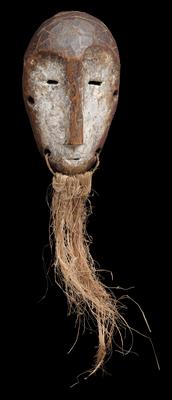 Lega, Democratic Republic of Congo: A small ‘identity-card’ mask made of ivory, called ‘Lukwakongo’. With kaolin coating and fastened beard. - Tribal Art