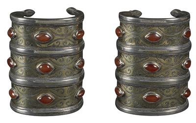 Afghanistan, Iran, Turkmenistan: tribe: Tekke Turkmens: a pair of bangles (2 items) from the Tekke Turkmens. Made of silver, with three rows each and partly gilded. Set with a total of 18 carnelians. - Tribal Art