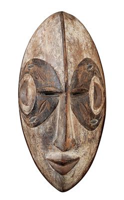 Ibo (or Igbo), Nigeria: a long, oval face mask of the Ibo, representing a ‘beautiful girl’ who comes from the afterlife and visits the living. - Tribal Art